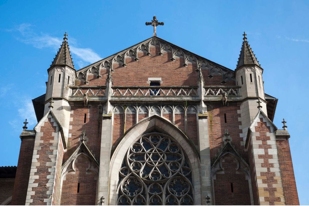 A picture of the unique architecture of Saint-Etienne cathedral. Taking a walking tour of Toulouse and see the famous Saint-Etienne cathedral. 