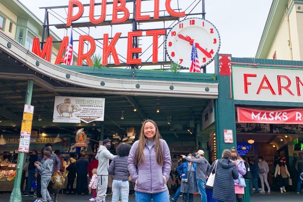 A picture of Kristin outside of the famous Pike Place Market in Seattle.