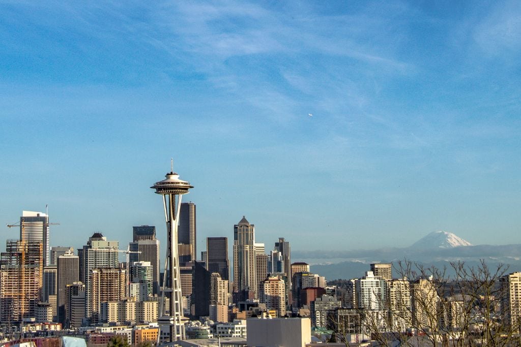 A picture of the Seattle skyline with Mount Rainier in the distance. As the most populous city in Washington, Seattle is on the more expensive side.