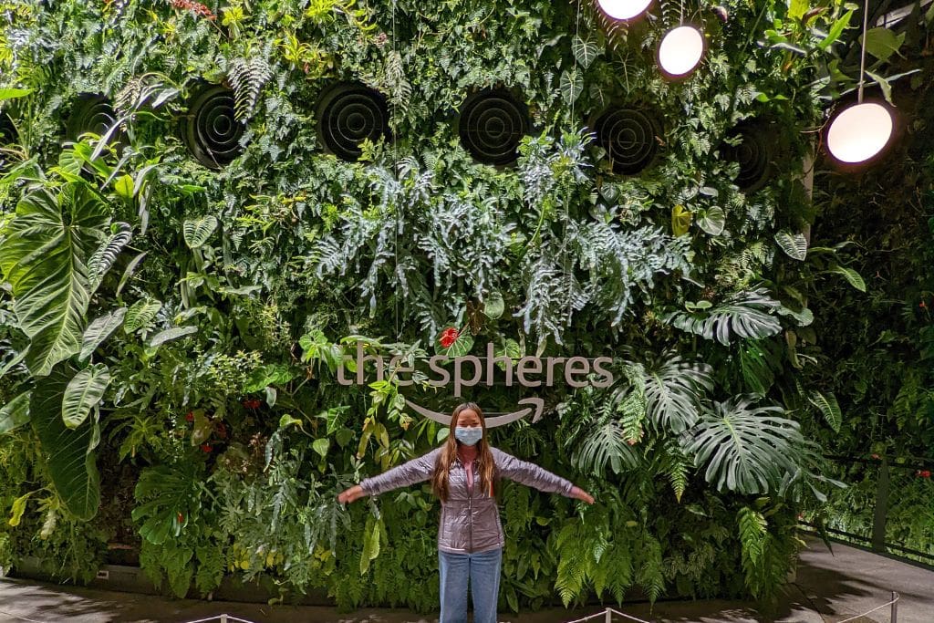 A picture of Kristin standing in front of one of the giant living walls at the Amazon Spheres in Seattle!