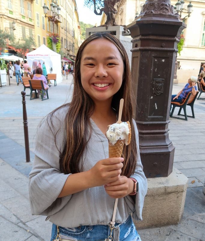 A picture of Kristin posting with some gourmet ice cream in Nice