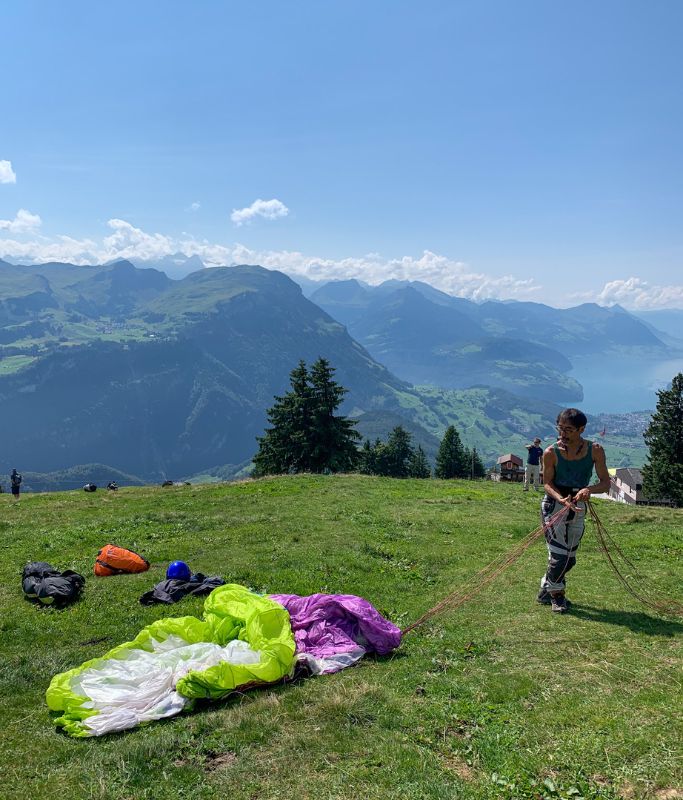 A picture of Kristin's pilot setting up the paraglider wing and doing all the necessary checks.