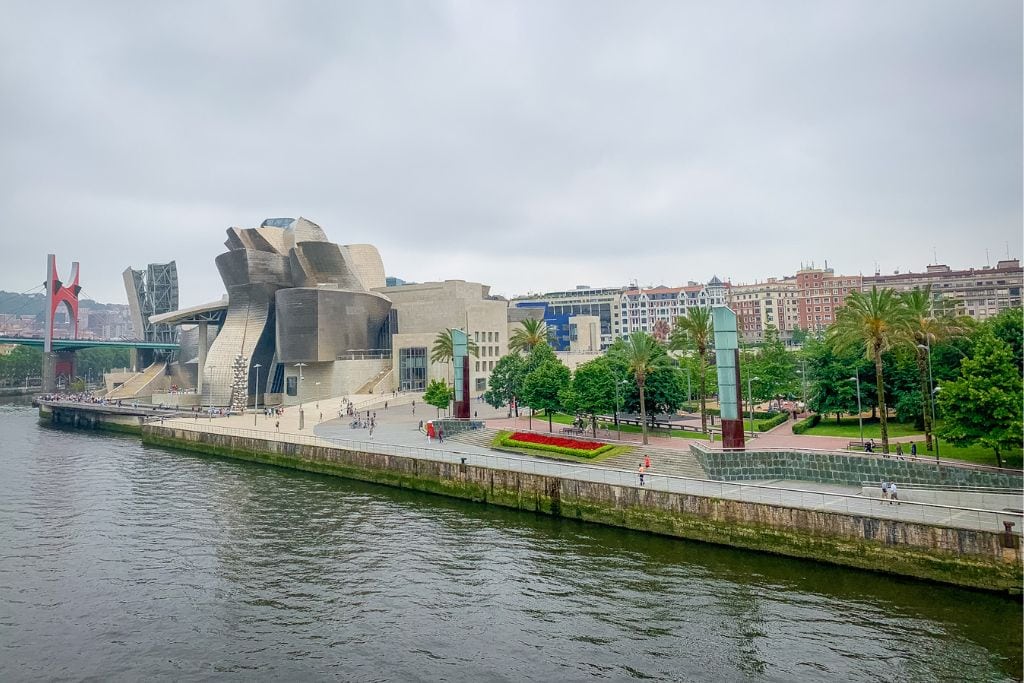 A picture of the Guggenheim museum and Nervión River. Seeing the incredible museum in real life is one reason Bilbao is worth visiting!