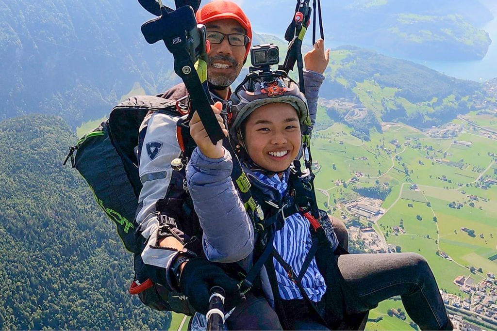 A picture of Kristin and her pilot paragliding. Yoshi even let Kristin steer for a bit while paragliding since he felt the conditions was safe!