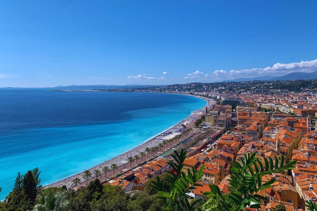 A picture of Nice's coastline from the top of Castle Hill. A couple of the food tours in Nice will end at the top of Castle Hill so you can admire the incredible views.