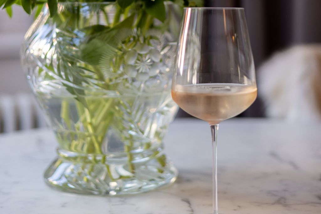 A picture of a glass of rosé. The Provence wine region is known for producing rosé, which you'll taste plenty of on these wine tours.