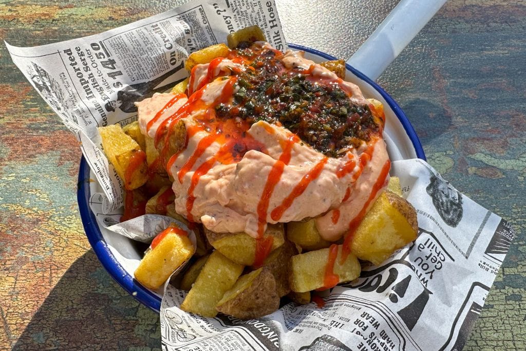 A picture of patatas bravas, a classic Spanish dish that you can indulge on with several of the tapas tours in Barcelona! 