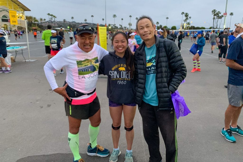 A picture of Kristin and her dad with a friend prior to the start of the La Jolla Half Marathon.