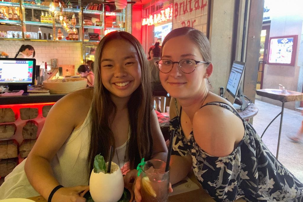 A picture of Kristin and her friend enjoying two very excellent cocktails.