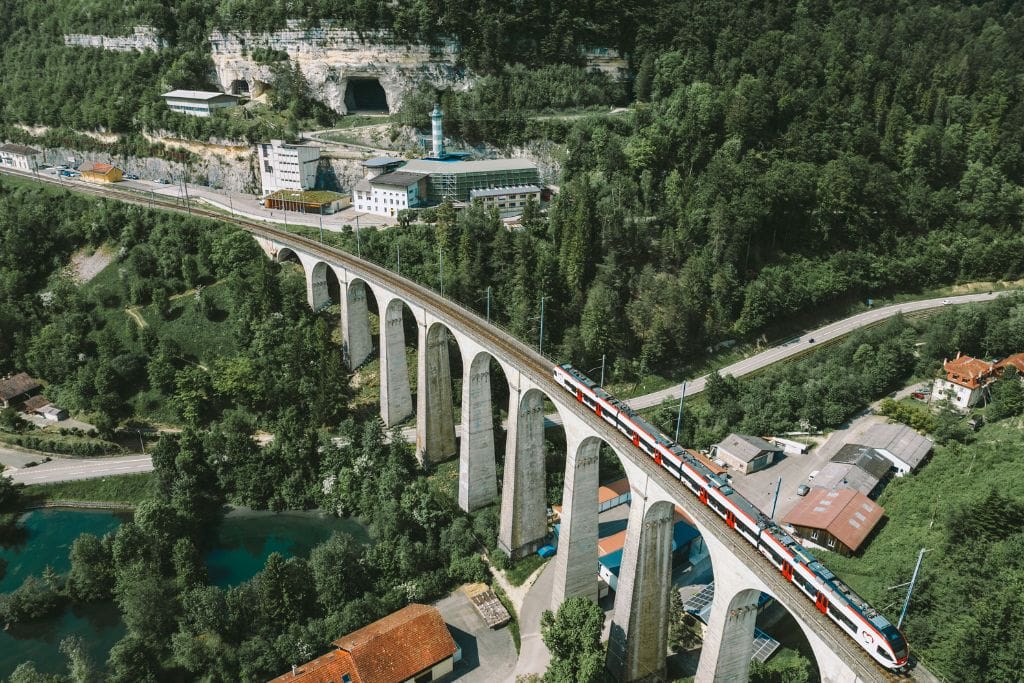 An aerial picture of a Swiss Train passing by.