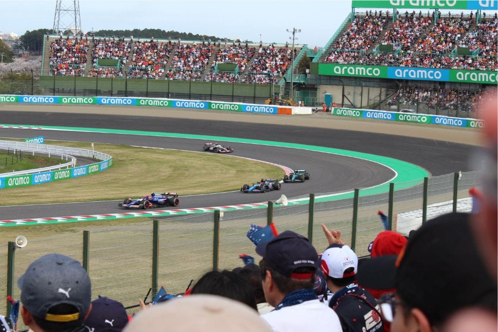 A picture of several cars racing the F1 circuit in Suzuka