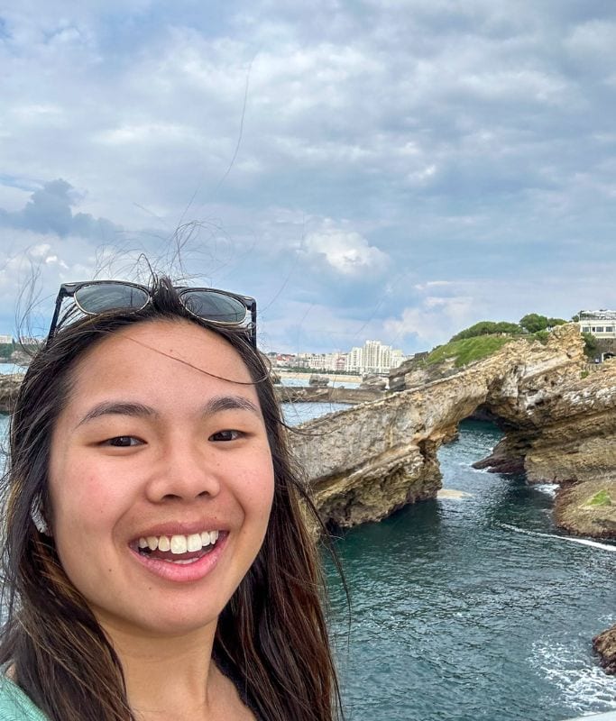 A picture of Kristin with the gorgeous Biarritz coastline in the background.