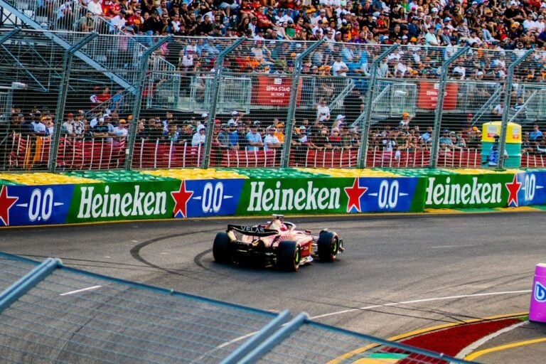 A picture of a Ferrari drive on track at Albert Park in Melbourne. This post contains 100+ F1 captions and quotes that you can use for Instagram.