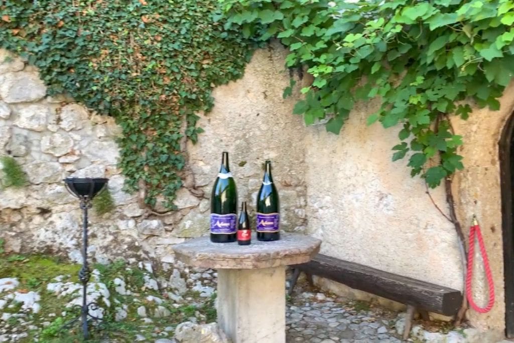 A picture of some wine bottles outside Bled Castle, where wine tasting tours are offered. For those who love wine, Lake Bled might be worth visiting just to save money on an immersive wine tasting tour!
