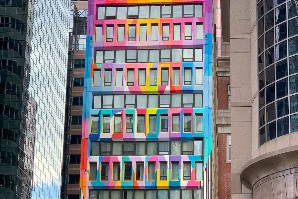 A picture of a super colorful building in downtown Montreal.