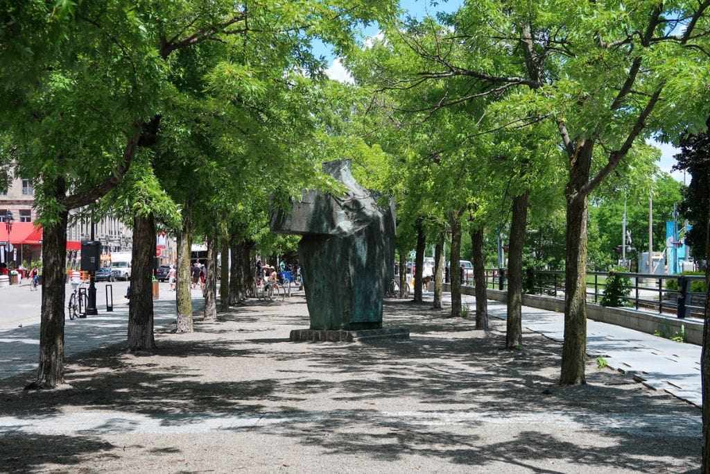 A picture of the flat, tree-lined streets in Old Montreal and near the Port. One way to make your trip to Montreal less expensive is to walk to most places in the downtown area and stack all your activities that require a metro pass on the same day.