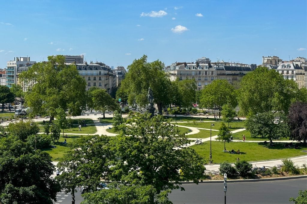 A picture of the super green and beautiful roundabout as seen from the People Hostel Paris Nation.