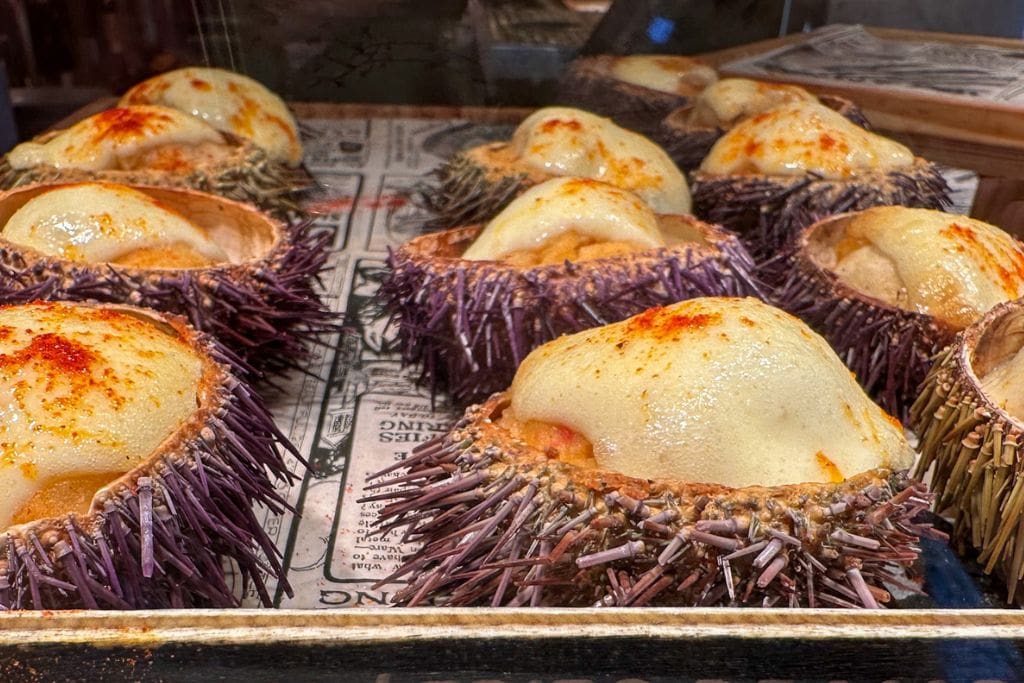 A picture of sea urchin pintxos! Some of the food tours in San Sebastian will also have you try their fresh seafood pintxos!