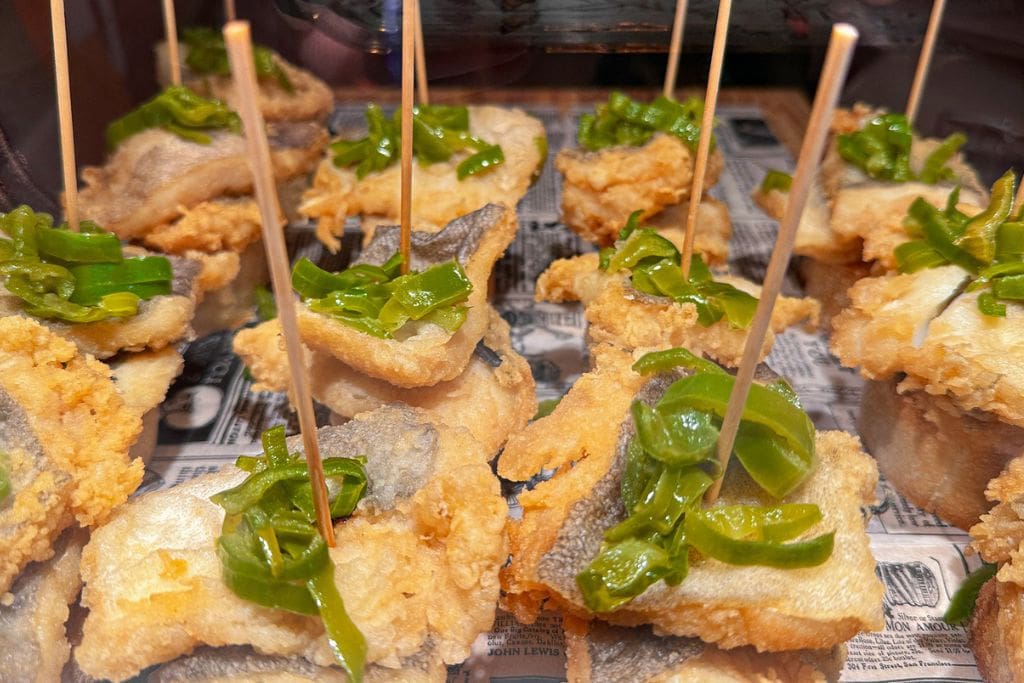 A picture of pintxos made with fried fish!