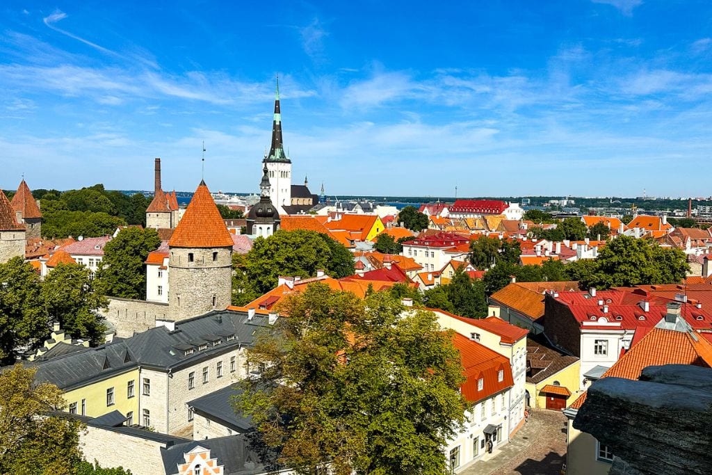 A picture of Tallinn's signature red rooftops and clock towers as seen from Patkuli Viewing Platform. This is a must-visit during your day trip from Helsinki to Tallinn!