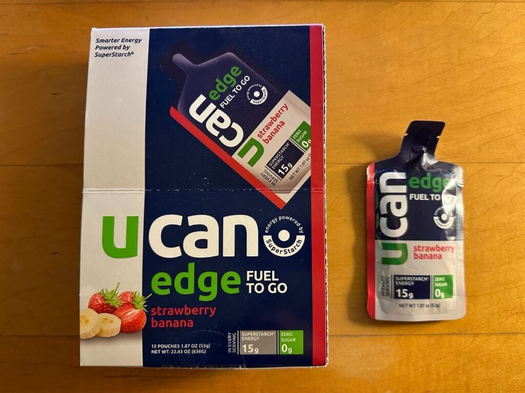 A picture of a box of Ucan fuel gels and a single fuel gel next to the box. Be sure to figure out what fuel gels you want to take during your Revel Big Bear race.