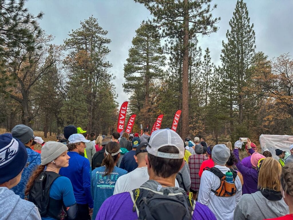 A picture of runners lined up, waiting for the start of the Revel Big Bear Marathon