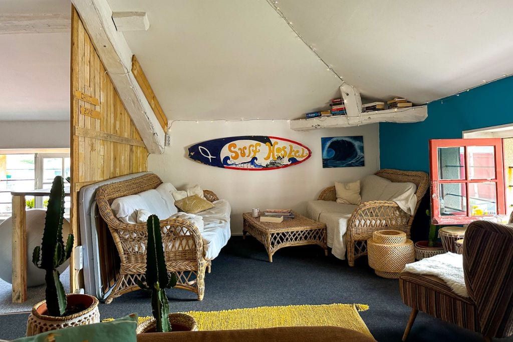 A picture of the abundance of seating in the upstairs common area at Biarritz Surf Hostel.