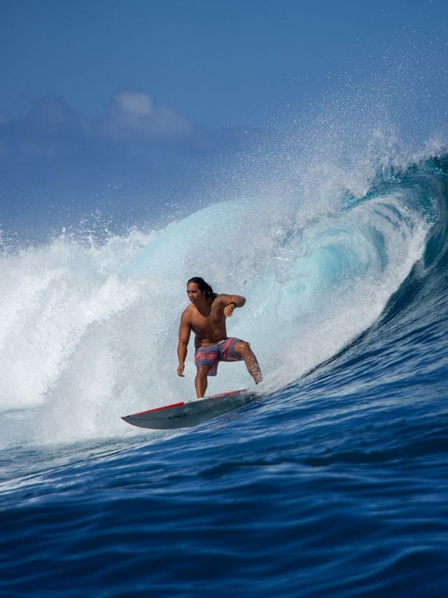 A picture of a local successfully surfing Tahiti's Teahupoo!