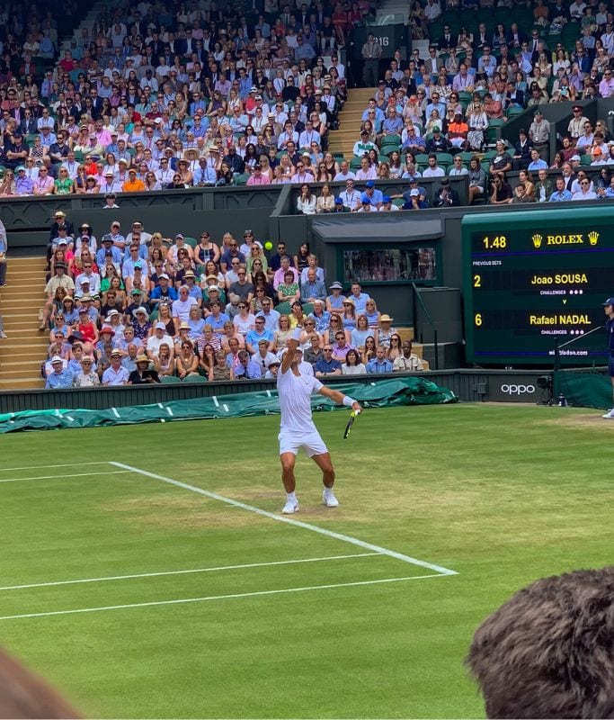 A picture of Rafael Nadal serving a ball on Centre Court at Wimbledon.