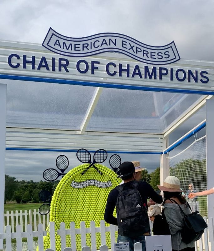 A picture of a wall of tennis balls that people could take pictures with as they waited in the queue to enter Wimbledon.
