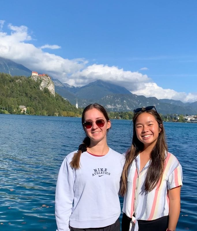 A picture of Kristin and her friend with the Lake bled castle in the background.