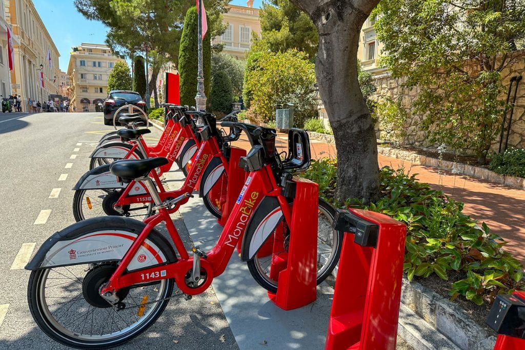 A picture of the bright red bikes that are available around Monaco for public use.