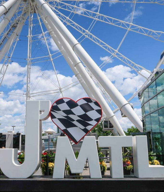 A picture of a giant Montreal sign decorated for race week in the city.