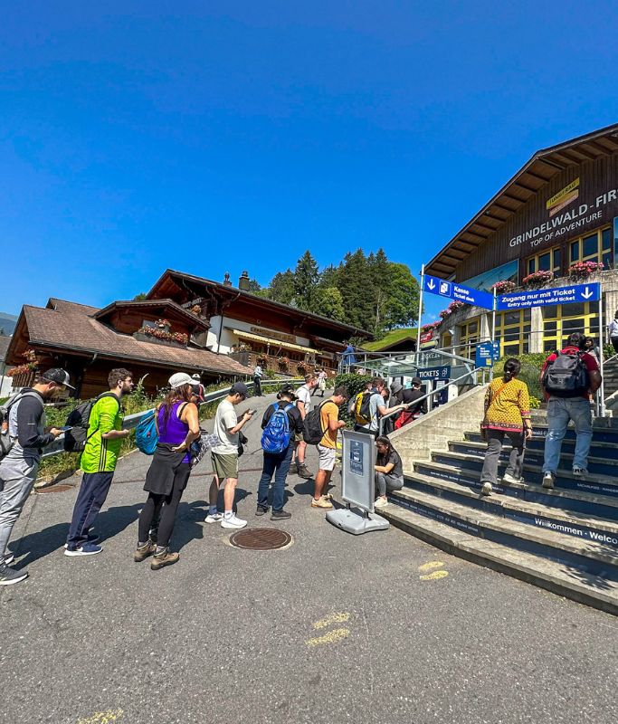 A picture of the on-site line to purchase gondola tickets for Grindelwald First.