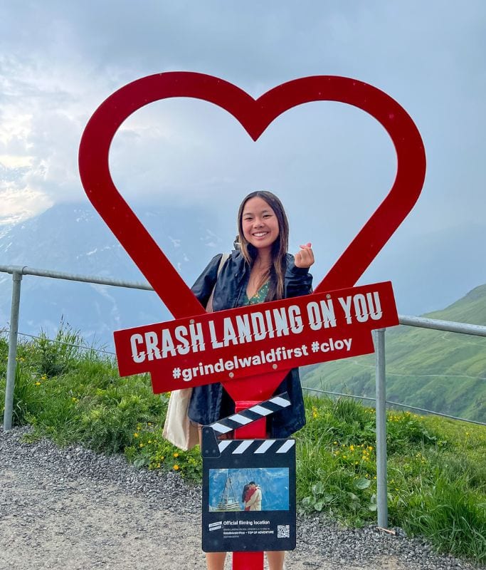 A picture of Kristin posing in front of the Crash Landing on You heart.