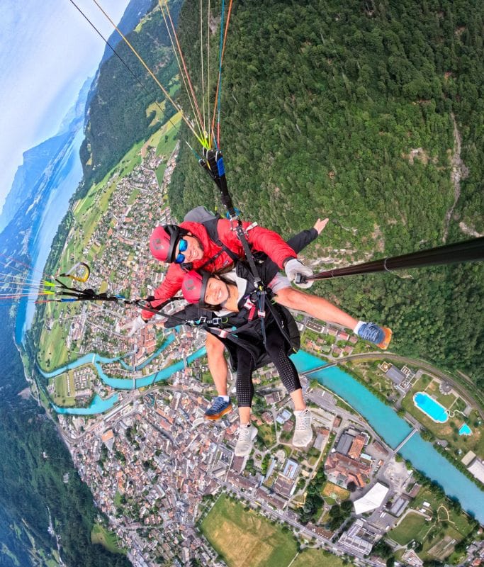 A picture of Kristin paragliding over Interlaken.