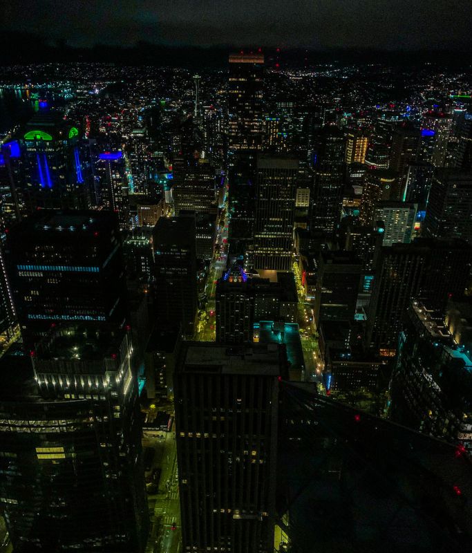 A picture of Seattle at night taken from the top of the Sky View Observatory. Since the Seattle Space Needle is so expensive, I would recommend visiting the Columbia Tower instead.