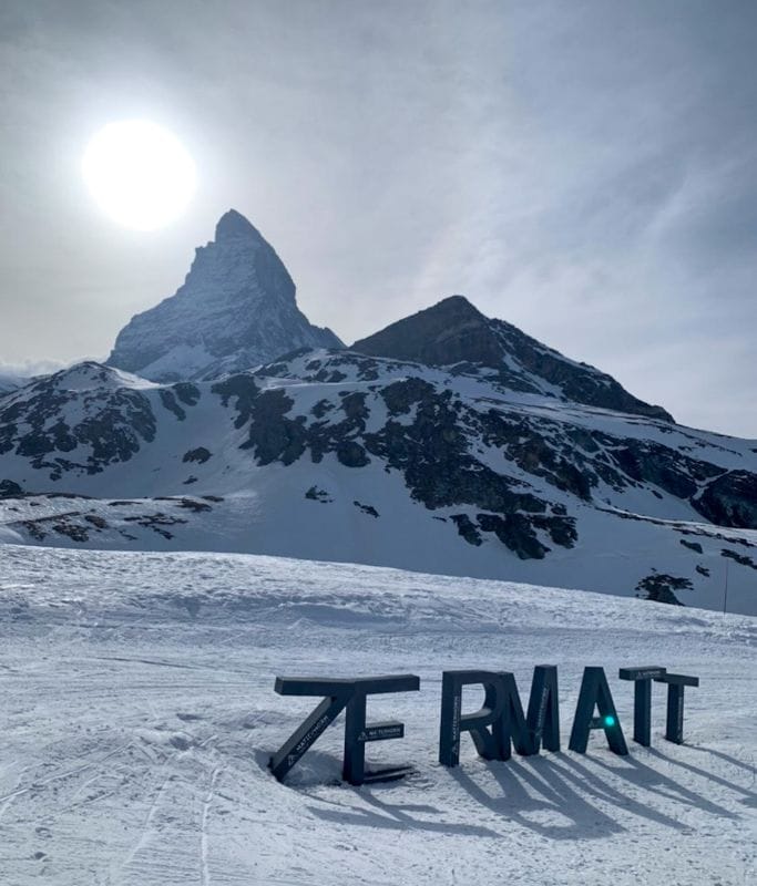 A picture of some giant blocks reading "Zermatt" and a snowy matterhorn in the background.