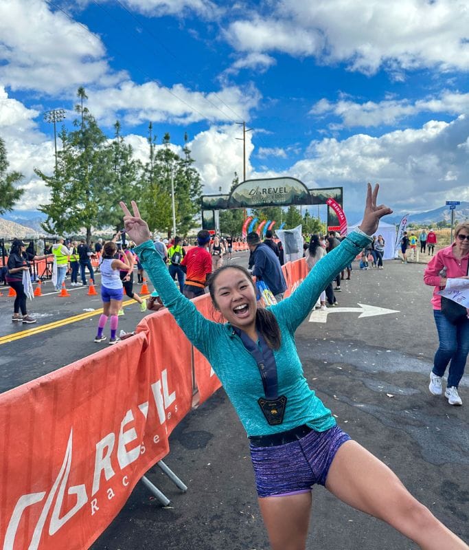 A picture of Kristin very happy with her medal from the marathon